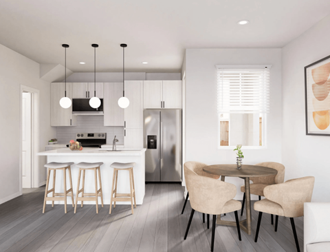 A modern kitchen with a bar area and a dining table set up.