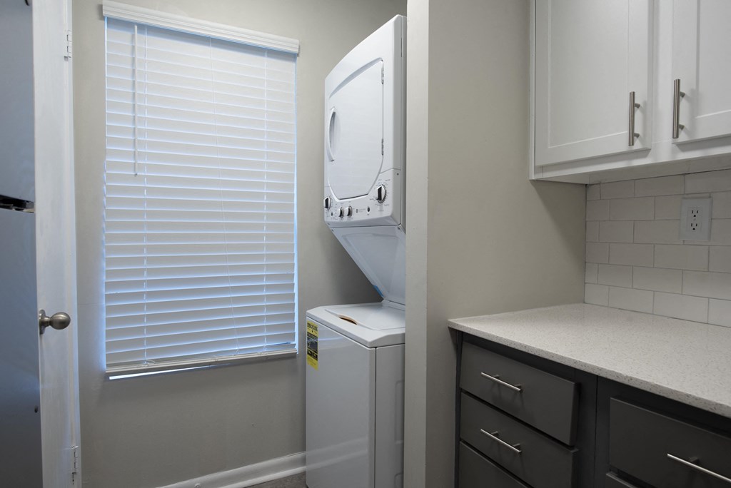 a small laundry room with a washer and dryer in it