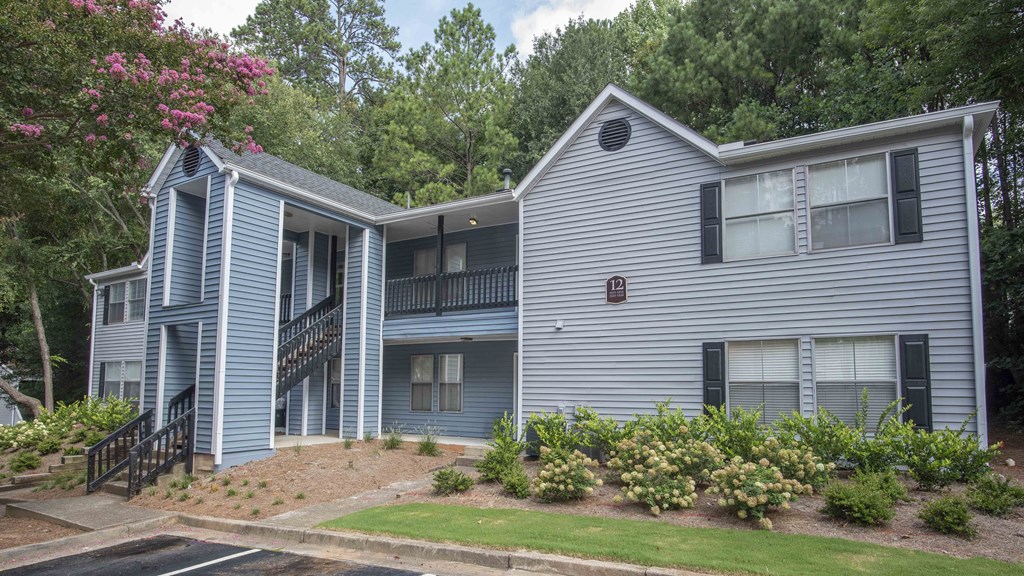 our apartments are located in a quiet neighborhood with trees and grass