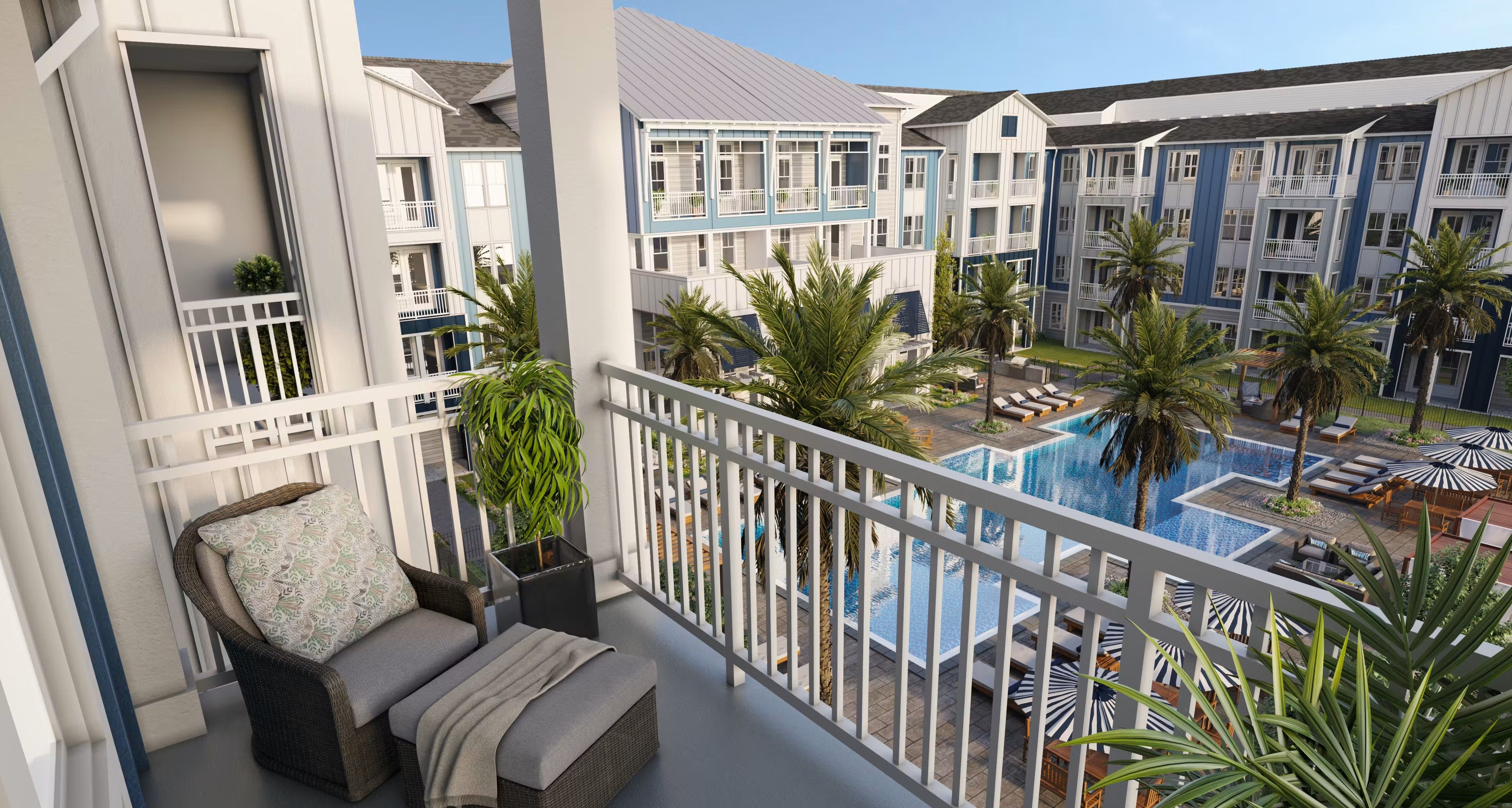A balcony with a chair and a potted plant overlooks a pool.