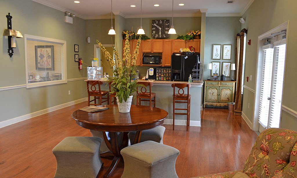 Kitchen with black appliances and dinning table at the Haven at Market Street Station Johnson City, TN