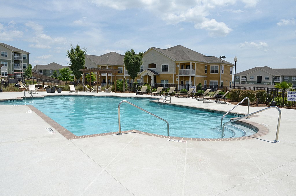 Pool courtyard with chairs and trees at the Haven at Market Street Aiken, SC