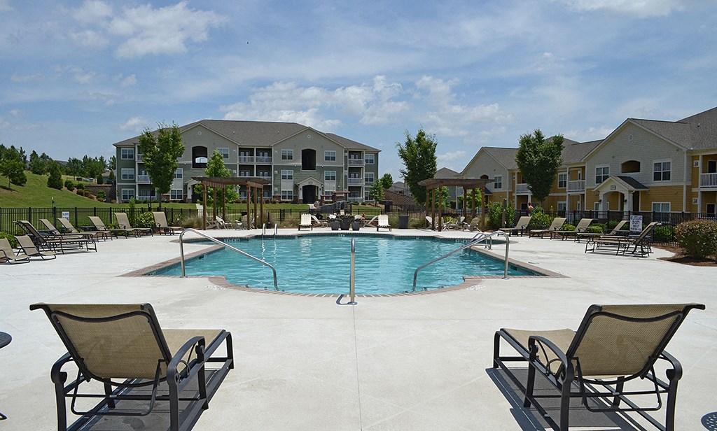 Spacious pool with comfortable lounge chairs at the Haven at Market Street Station Aiken, SC