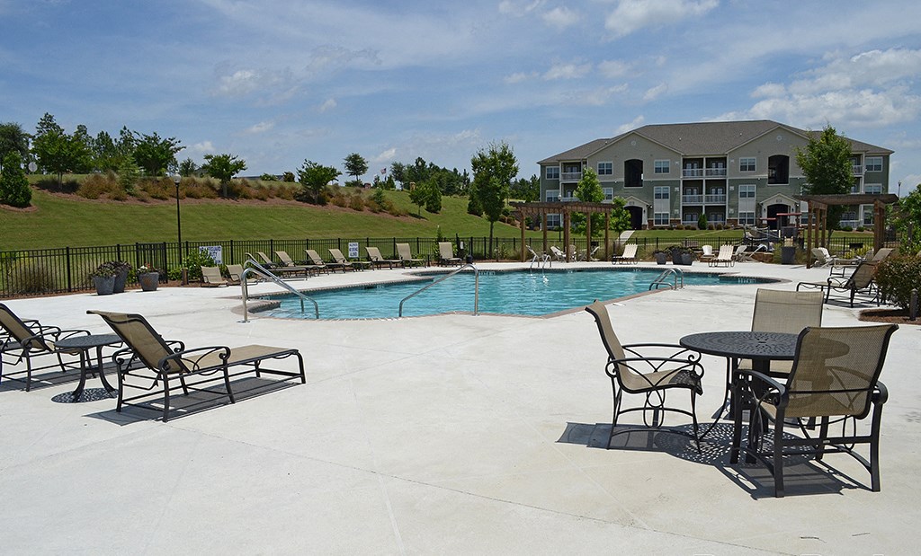 Sparkling pool with sundeck and lounge chairs at the Haven at Market Street Station Aiken, SC