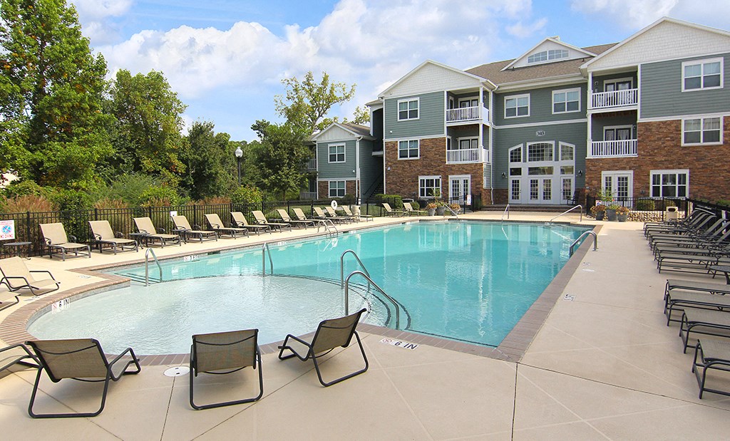 Pool with chairs at the Haven at Reed Creek Apartments Martinez, GA