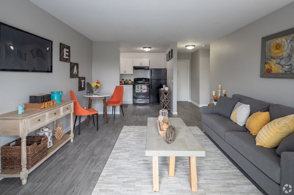 a living room with gray walls and a gray couch