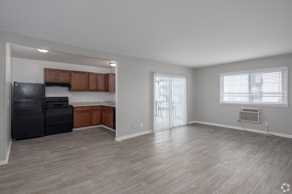 a kitchen and living room in an apartment