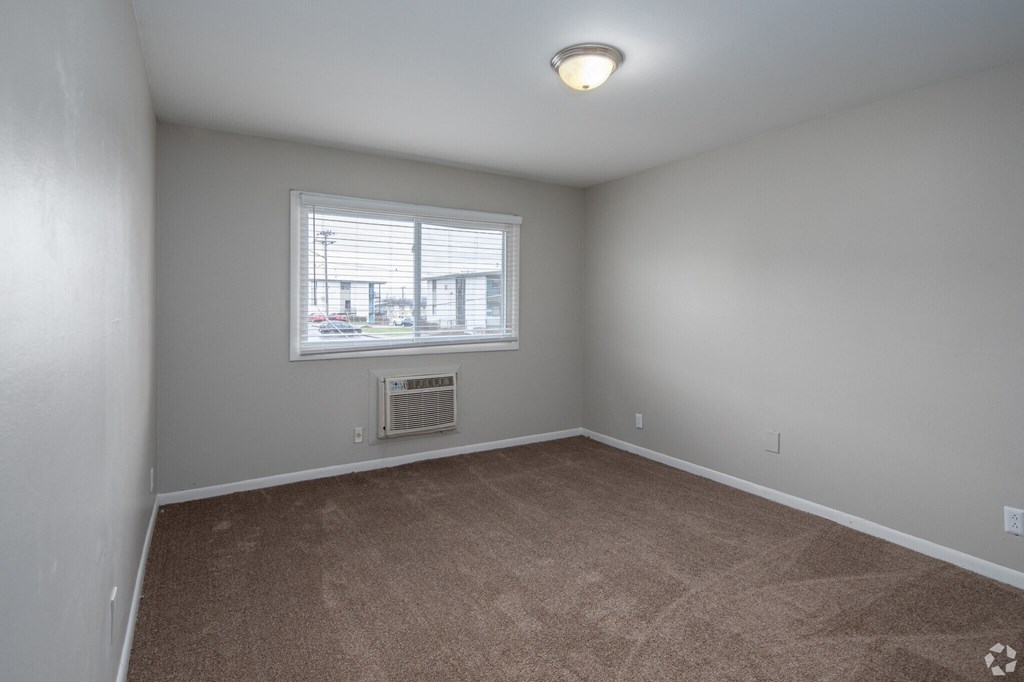 a bedroom at the acadia park apartments in houma, la