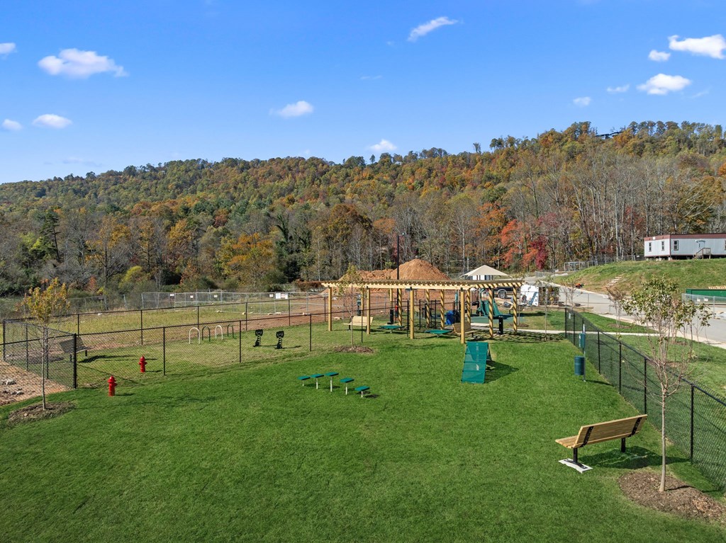 A playground with a swing set and a slide.