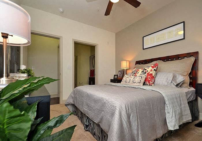 a bedroom with a bed and a ceiling fan - Photo Gallery