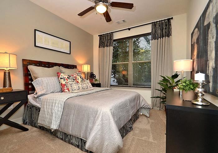 a bedroom with a bed and a ceiling fan - Photo Gallery