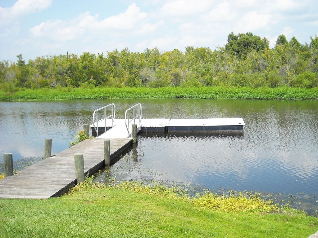 Lake with a dock at Lakewood Lodge apartments, Hanahan, SC