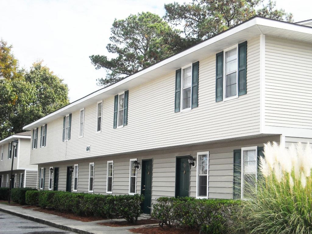 Apartment exterior entrance with siding at Lakewood Lodge, Hannahan, SC