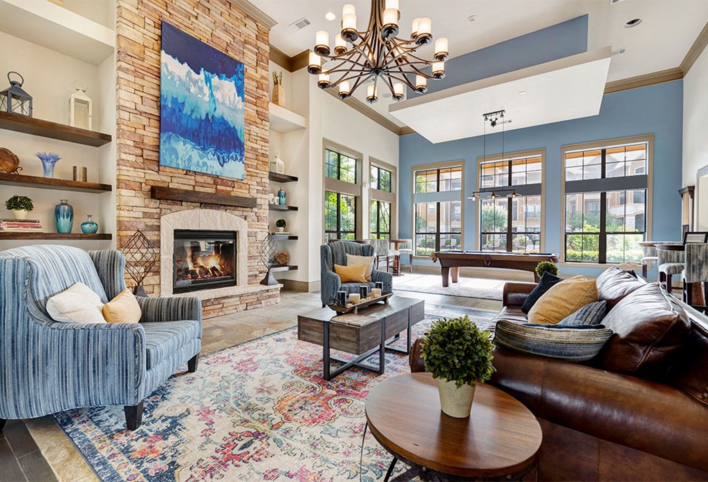 a living room with a fireplace and couches