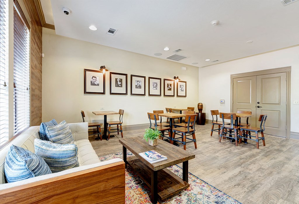 a living room with a couch and a table with chairs