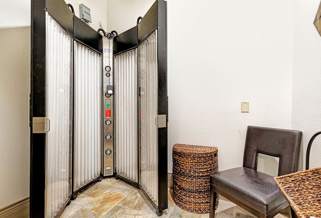 the elevator in the building has a chair and a table