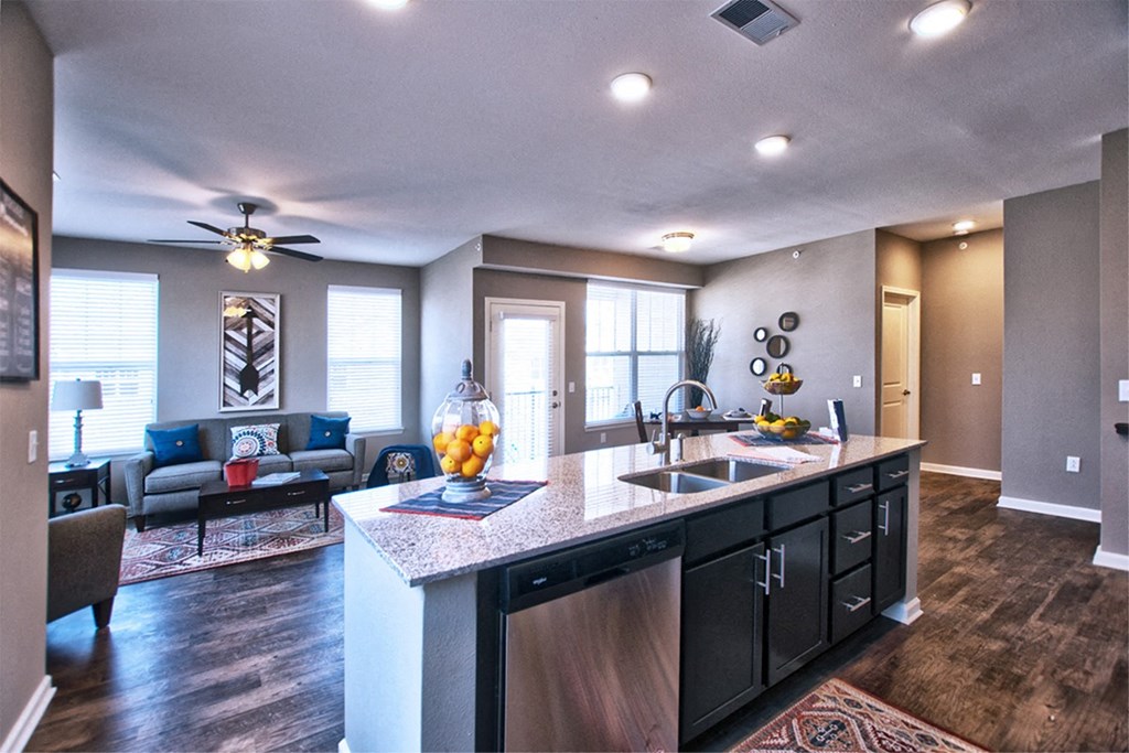 a kitchen with a large island and a living room in the background at Park 33, Goshen Indiana