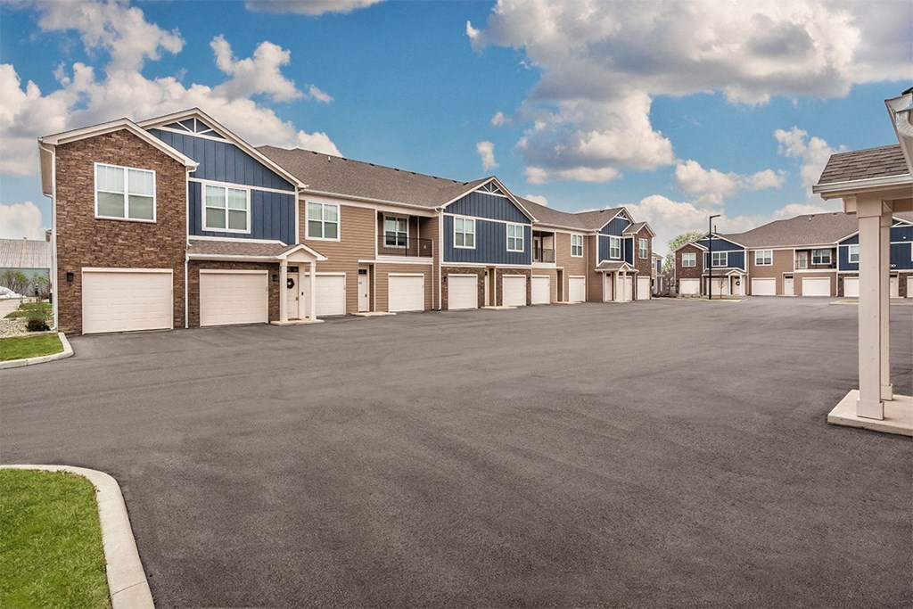 a row of townhomes with a tarmac driveway at Park 33, Goshen, 46526