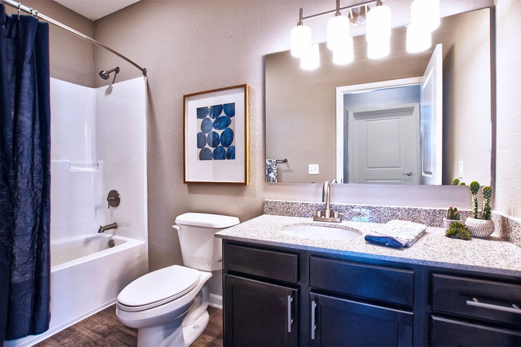 a bathroom with a toilet sink and bathtub at Park 33, Goshen, 46526