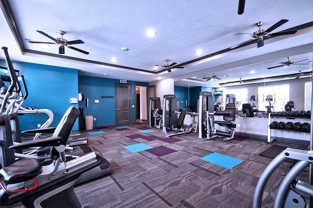 a large gym with cardio machines and weights at Park 33, Goshen, IN 46526