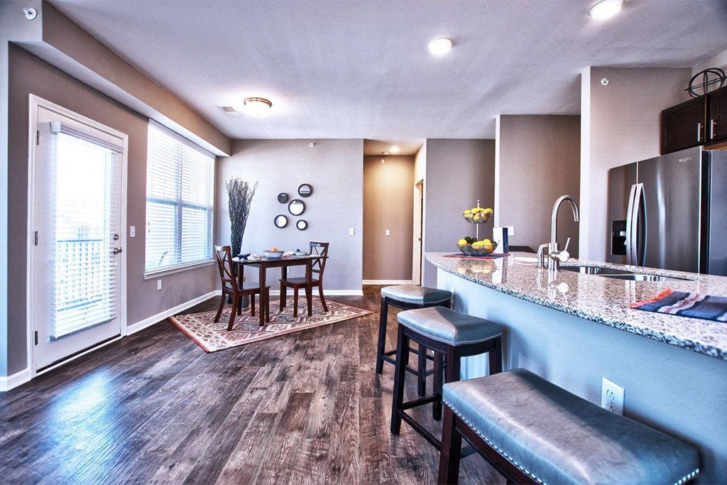 a kitchen and living room with a table and chairs at Park 33, Goshen Indiana