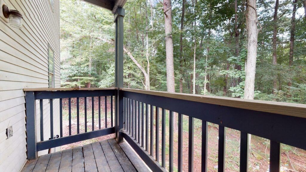 the view from the deck of a cabin in the woods