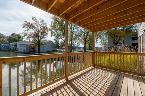 a deck with a view of a body of water