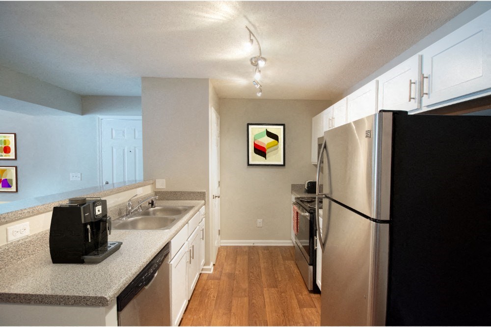 a kitchen with stainless steel appliances and granite counter tops