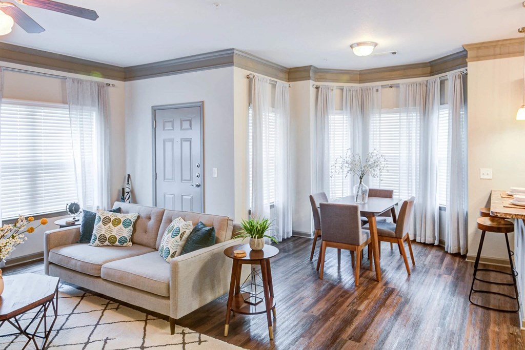 a living room and dining room with a couch and a table at Century HomePlace, Prattville Alabama