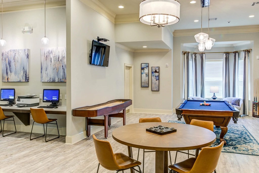 a game room with a pool table and a tv at Century HomePlace, Prattville