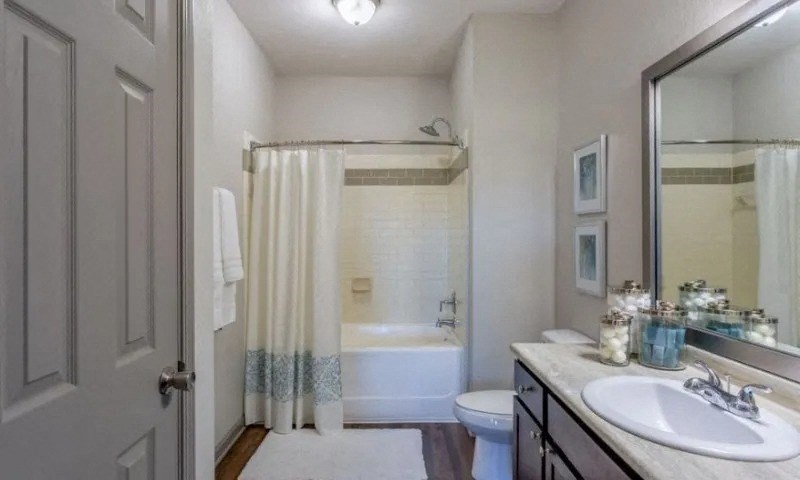 a bathroom with a shower and a sink and a toilet at Century HomePlace, Prattville, AL 36066