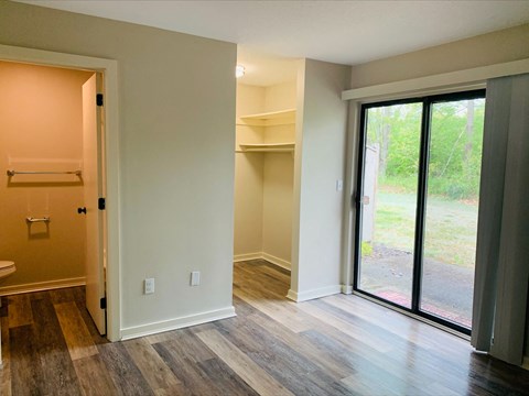 Bedroom with ensuite bathroom and builtin closet at Briarcliff at Quechee Apartments, Quechee