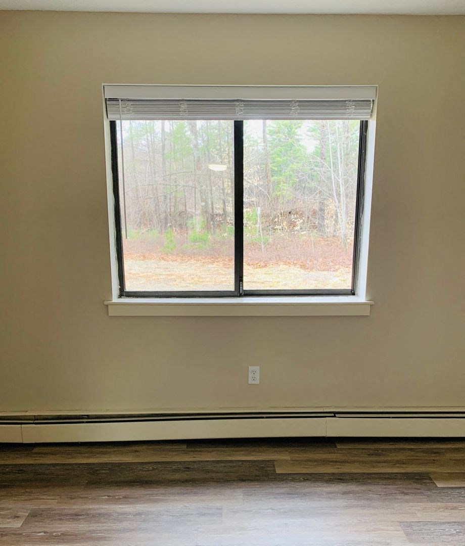 a large window in a room with a wood floor at Briarcliff at Quechee, Quechee Vermont