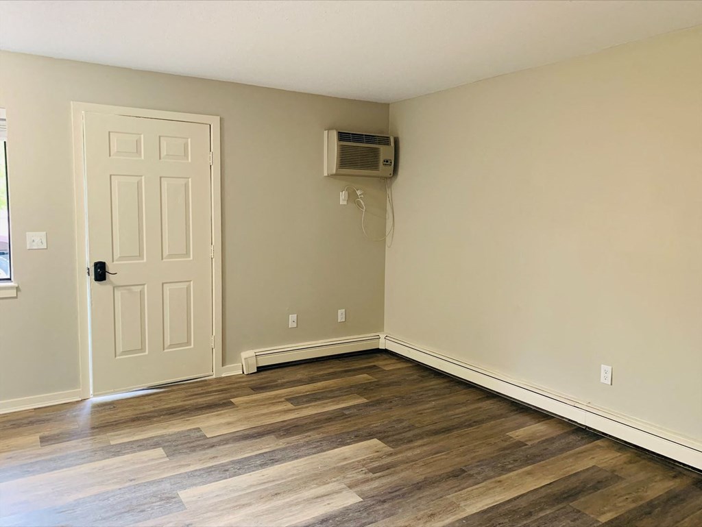a empty room with a door and a air conditioner at Briarcliff at Quechee, Quechee Vermont