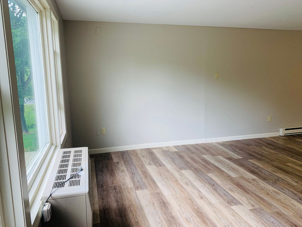 an empty room with wood floors and a window at Briarcliff at Quechee, Quechee Vermont