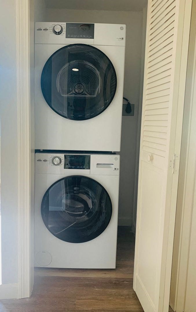 a washing machine and a washer and dryer in a closet at Briarcliff at Quechee, Vermont
