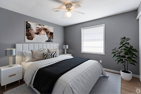an image of a bedroom with a bed and a ceiling fan