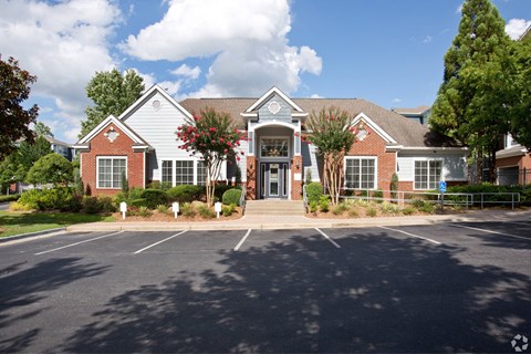 the front of a house with a parking lot