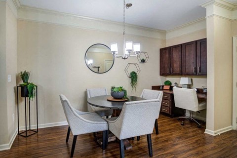 a dining room with a table and chairs at Century Lakeshore Crossings, Birmingham, AL 35211