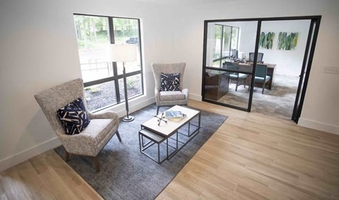 A living room with a chair and a table.