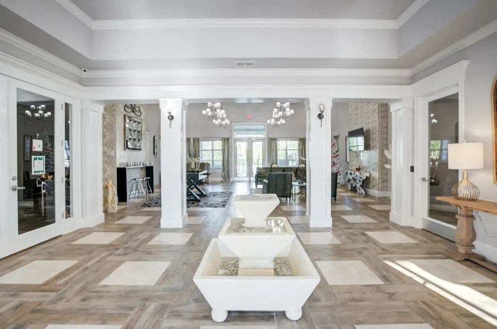 A spacious living room with a white coffee table in the center.at Century Ariva, Lakeland  