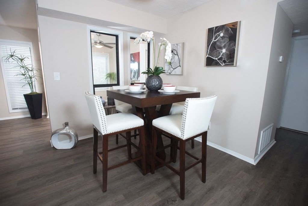 A dining room with a wooden table and chairs at Ridge Crossings Apartments, Hoover