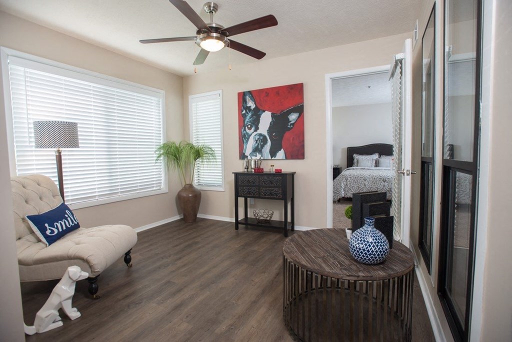A living room with a white sofa and a wooden coffee table at Ridge Crossings Apartments, Alabama 35244