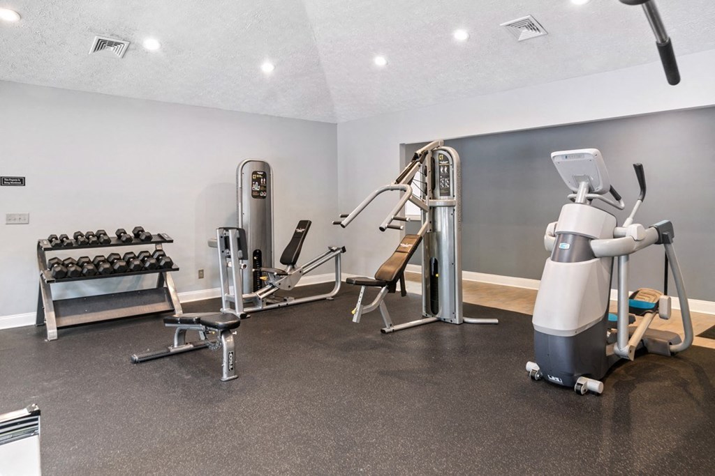 A gym with a variety of equipment at Ridge Crossings Apartments, Hoover, Alabama