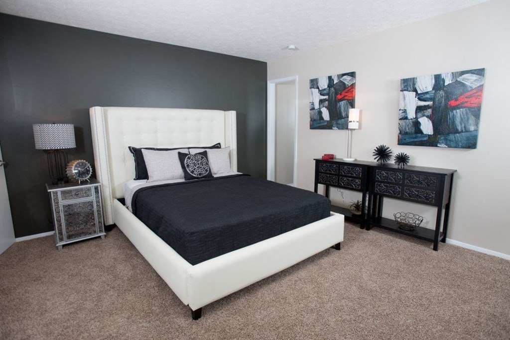 A bedroom with a large bed and two nightstands at Ridge Crossings Apartments, Alabama 35244