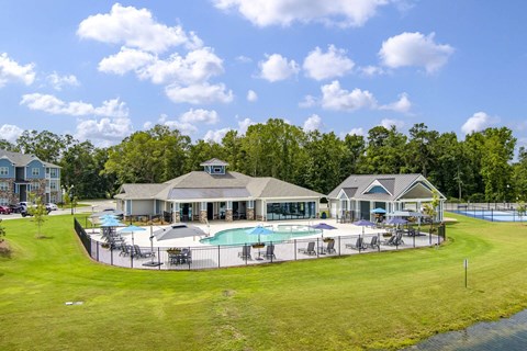 A large house with a pool in the backyard.