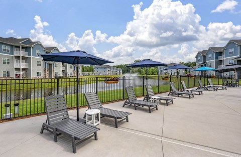 A sunny day at the outdoor seating area of a residential complex.