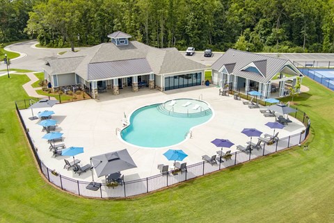 A large house with a pool in the backyard.