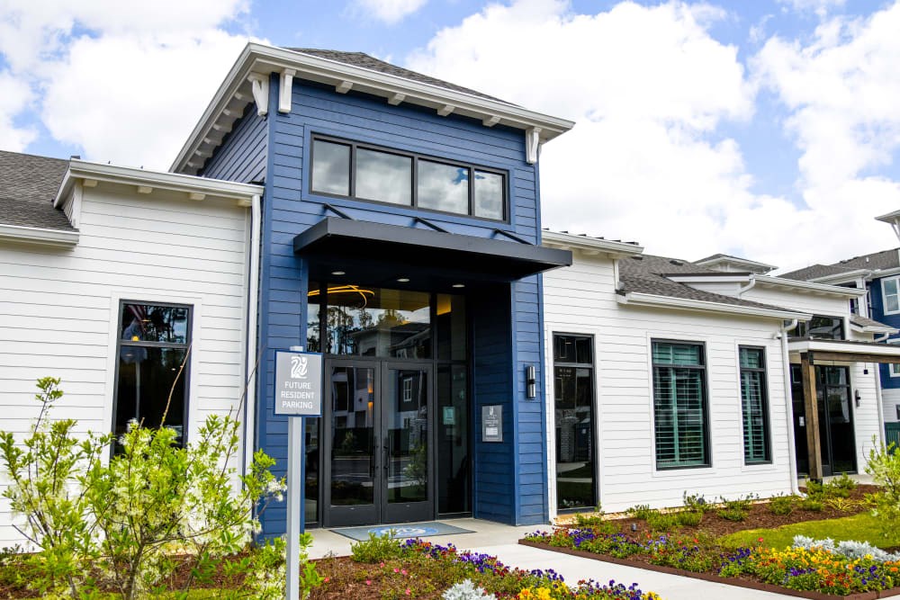 A blue and white building with a sign that reads "22" in front of it.