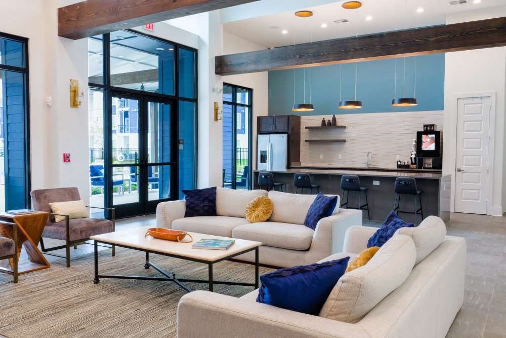 A modern living room with a white couch and a coffee table.
